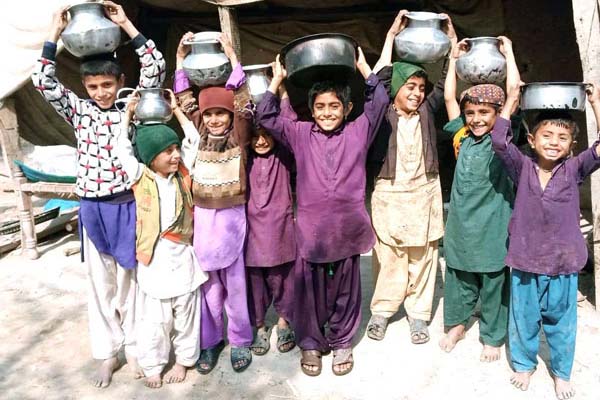 Boys excited about access to safe, clean water from new well in their village